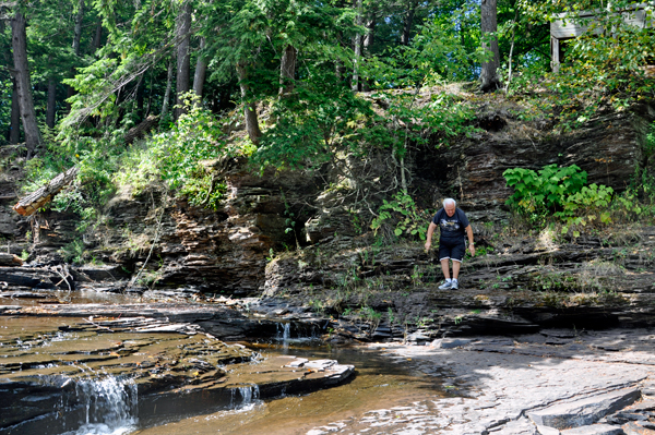 Lee Duquette apporaching the side of Nawadaha Falls